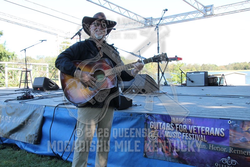Jeff Creech performing live before the Inaugural Guitars for Vets Music Festival banner at Queenslake