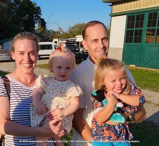 James Yacone with his wife, daughter, and Aspen Fox at Queenslake