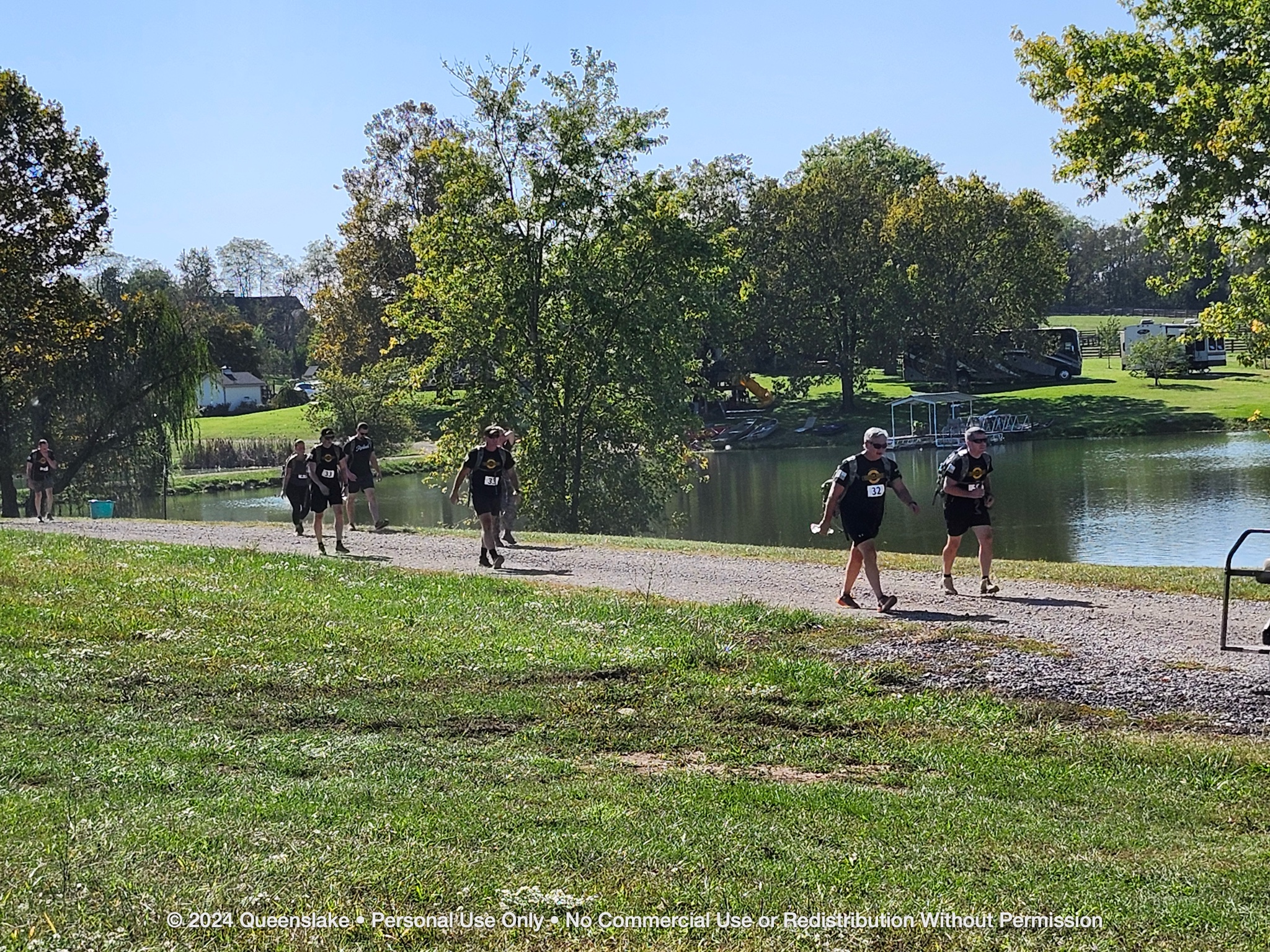 Mike Durant and Team 32 marching down the East Lake Road under the autumn morning sky.