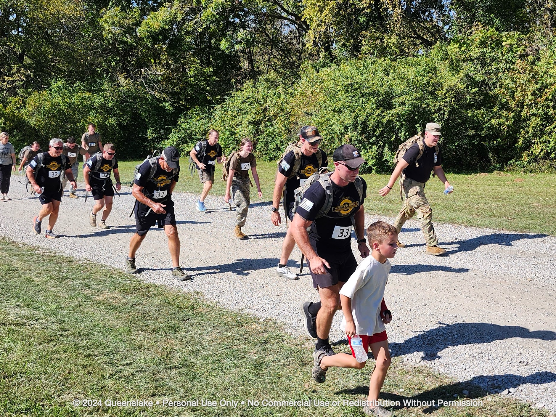 Both pilot squads (Team 32 and Team 33) surging together toward the final mile finish.
