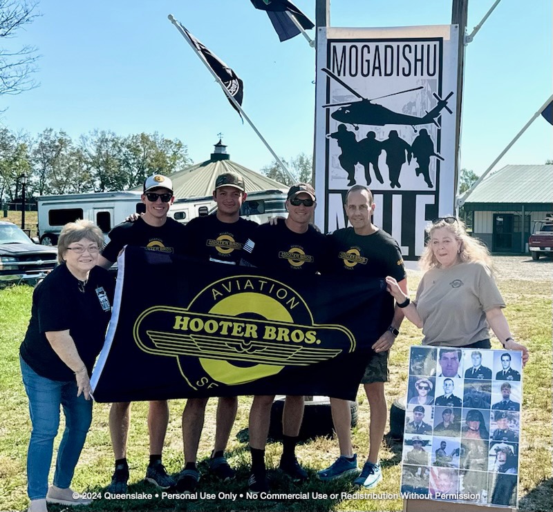 Willa Frank, Shari Briley, Jim Yacone, and Team 33 gathered in sacred memory at the Mogadishu Mile memorial sign.