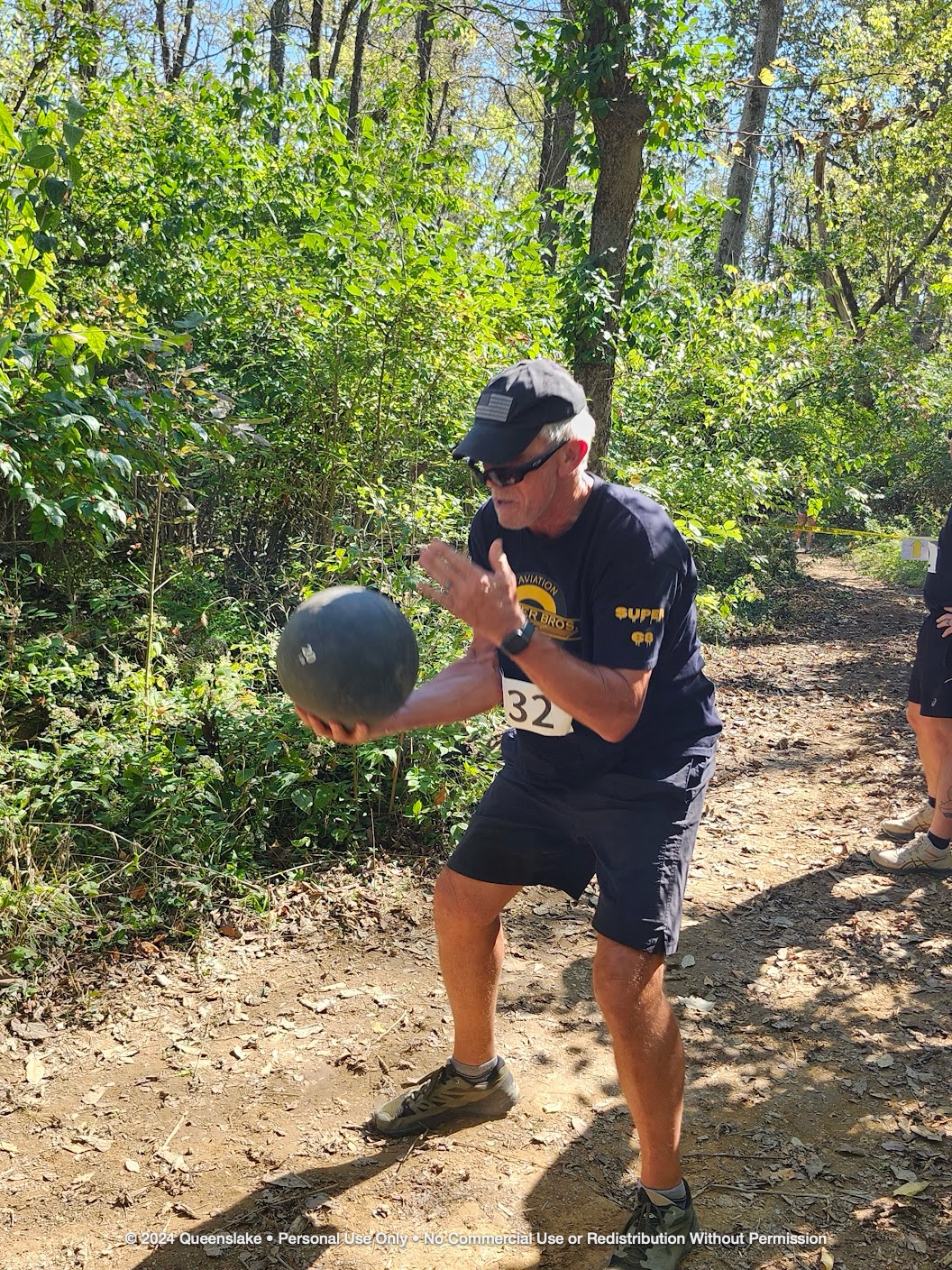 CW4 Dan Jollota powering through the medicine ball slam obstacle on the Queenslake course.