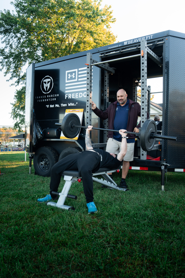 Barbell Bench Press at BeaverFit Trailer & Under Armour Freedom Banner