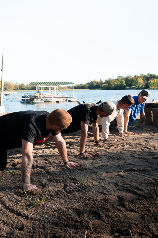 Synchronized Pushups on Normandy Beach Sand