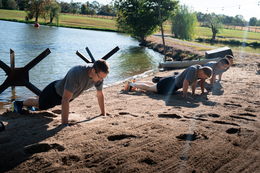 EKU Cadets Sand Pushups Beside Czech Hedgehog in Lake