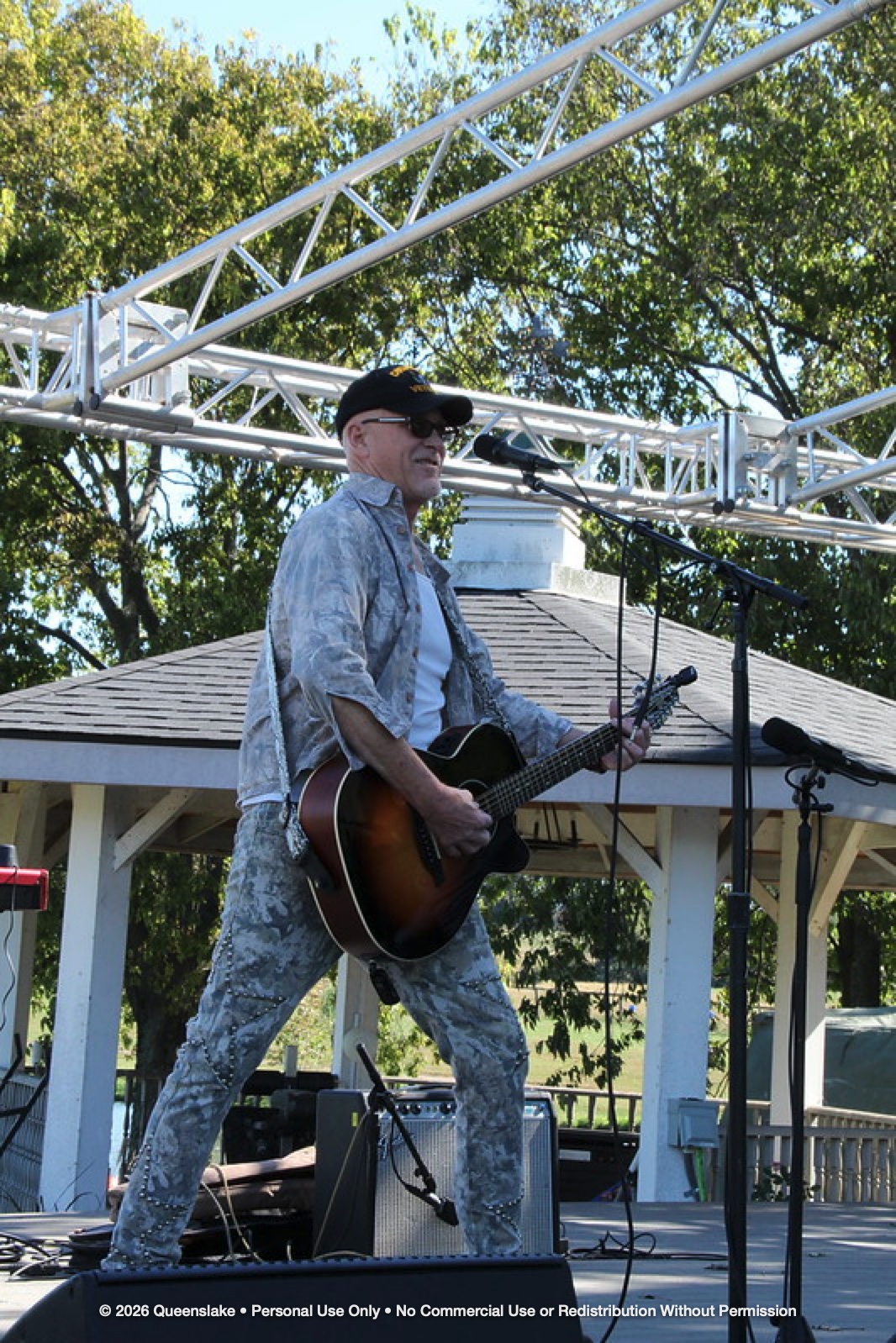U.S. Navy Veteran Jeff Cole rocking live on the Queenslake waterfront stage during the 2026 Guitars for Vets Music Festival